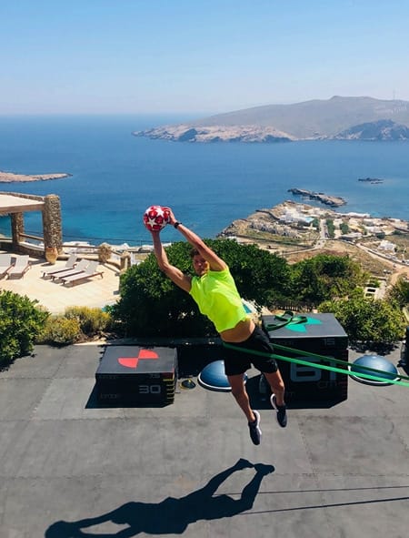 Professional and recreational athletes high intensity training in Mykonos during the summer pre season training.